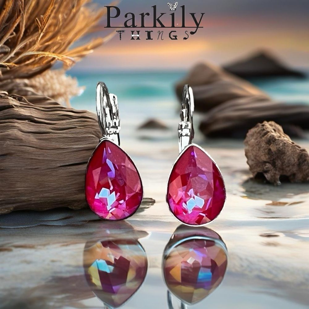 Handcrafted earrings with a sparkly reddish pinkish teardrop Swarovski crystal
